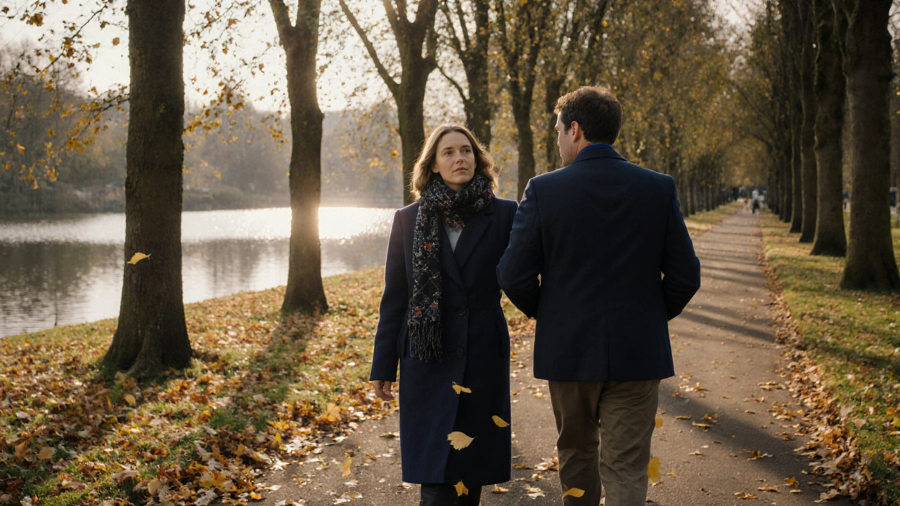 Two people walking peacefully through Hyde Park in autumn, dressed casually, sharing a calm moment.