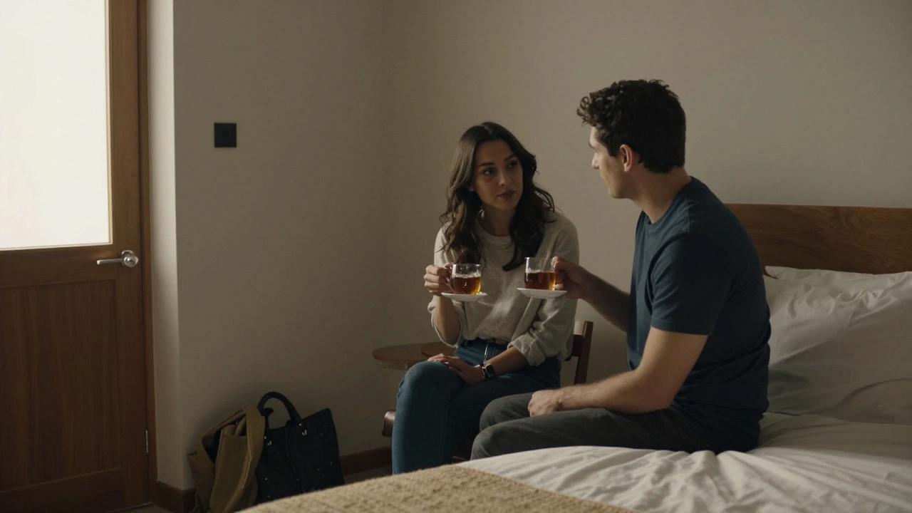 A calm, intimate conversation between two people in a hotel room, sharing tea without physical contact.