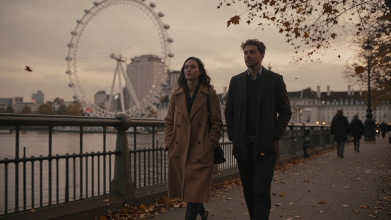 A couple walking peacefully along the Thames at dusk, embodying quiet companionship in London.