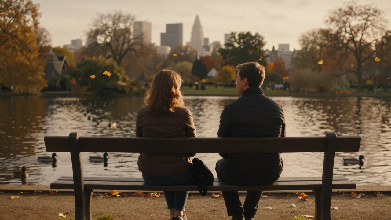 Two people sitting peacefully on a park bench in London, watching ducks on the water at sunset.